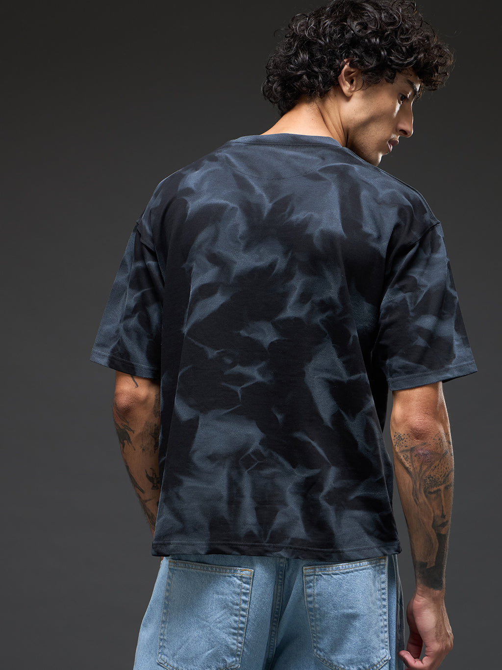 Black spray and puff print oversized t-shirt from Rudrajap, featuring bold graphic design and relaxed fit.