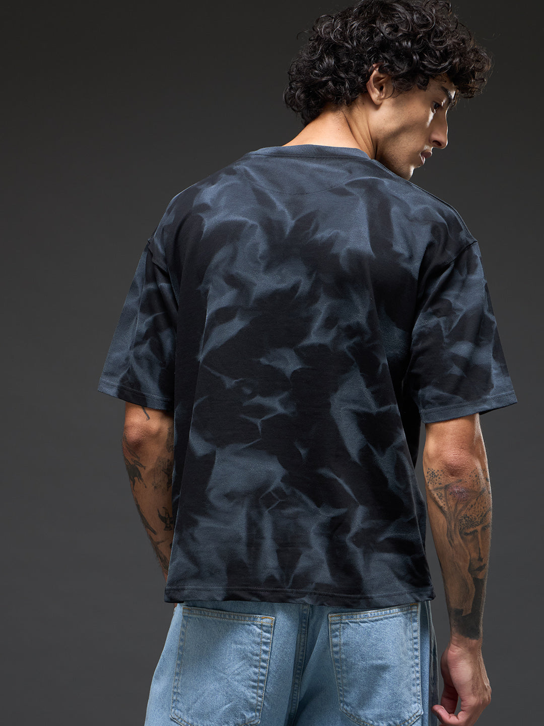 Black spray and puff print oversized t-shirt from Rudrajap, featuring bold graphic design and relaxed fit.