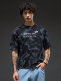 Black spray and puff print oversized T-shirt by Rudrajap featuring bold graphic design and relaxed fit.