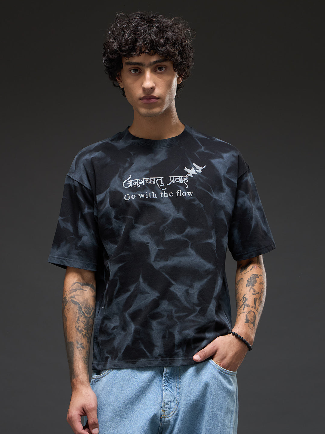 Black spray and puff print oversized T-shirt by Rudrajap featuring bold graphic design and relaxed fit.