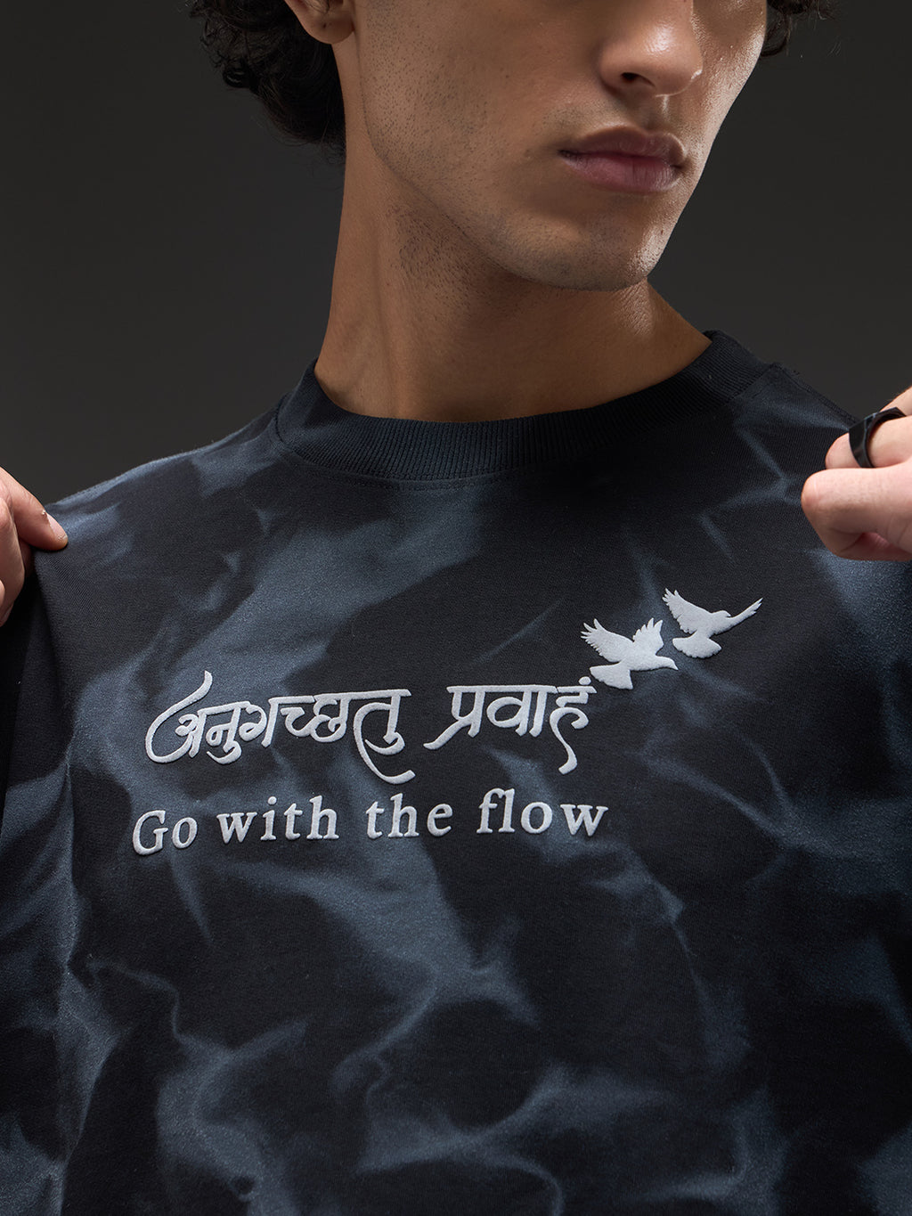 Black oversized T-shirt with spray and puff print design by Rudrajap, featuring a relaxed fit and casual style.