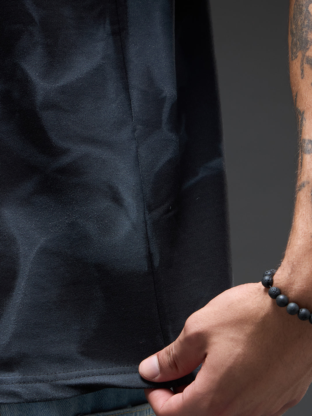 Black oversized T-shirt with spray and puff print from Rudrajap's Go with the Flow collection, featuring bold graphic details.