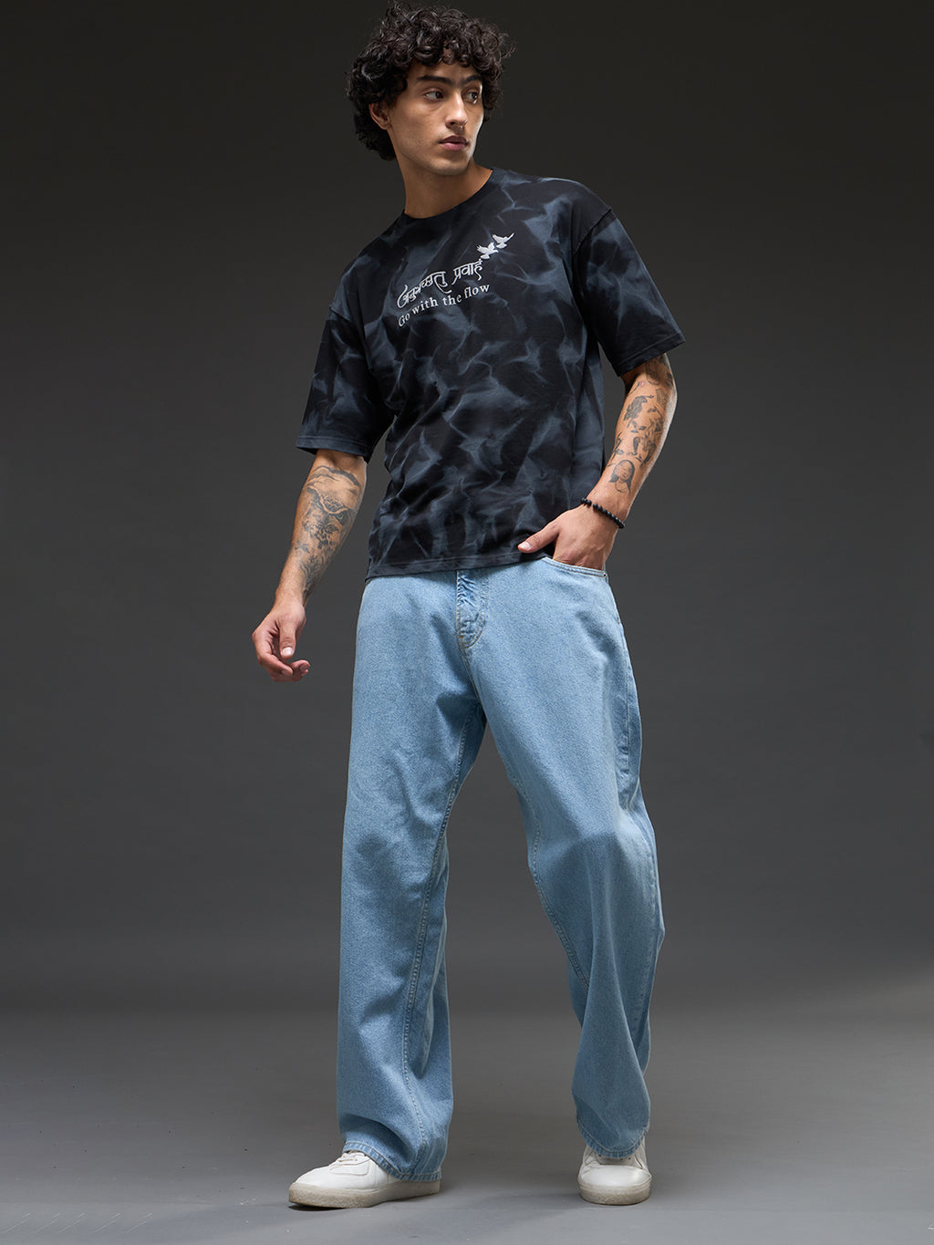 Black oversized T-shirt by Rudrajap featuring spray and puff print details, casual fit, and comfortable fabric.
