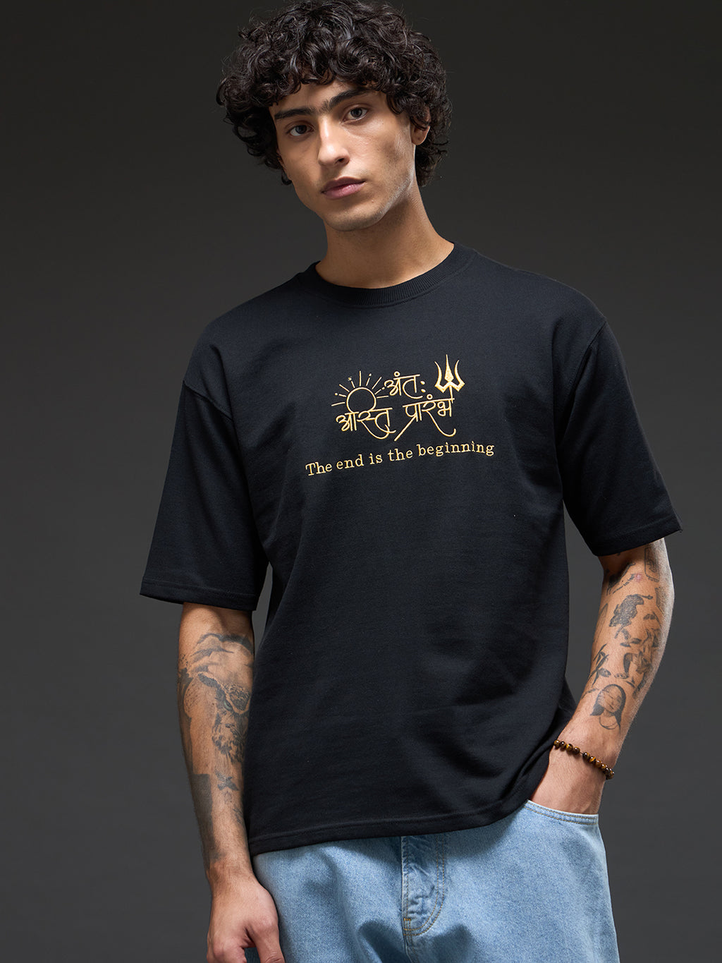 Black and mustard recycled oversized tee by Rudrajap featuring a relaxed fit and eco-friendly fabric.