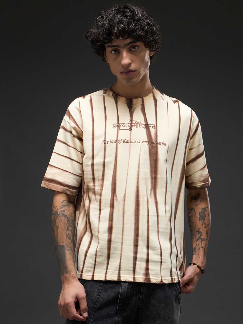 Beige oversized tee with spray and puff print from Rudrajap The Law of Karma, showing a relaxed fit and stylish design.