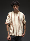 Beige oversized tee with spray and puff print from Rudrajap The Law of Karma, showing a relaxed fit and stylish design.