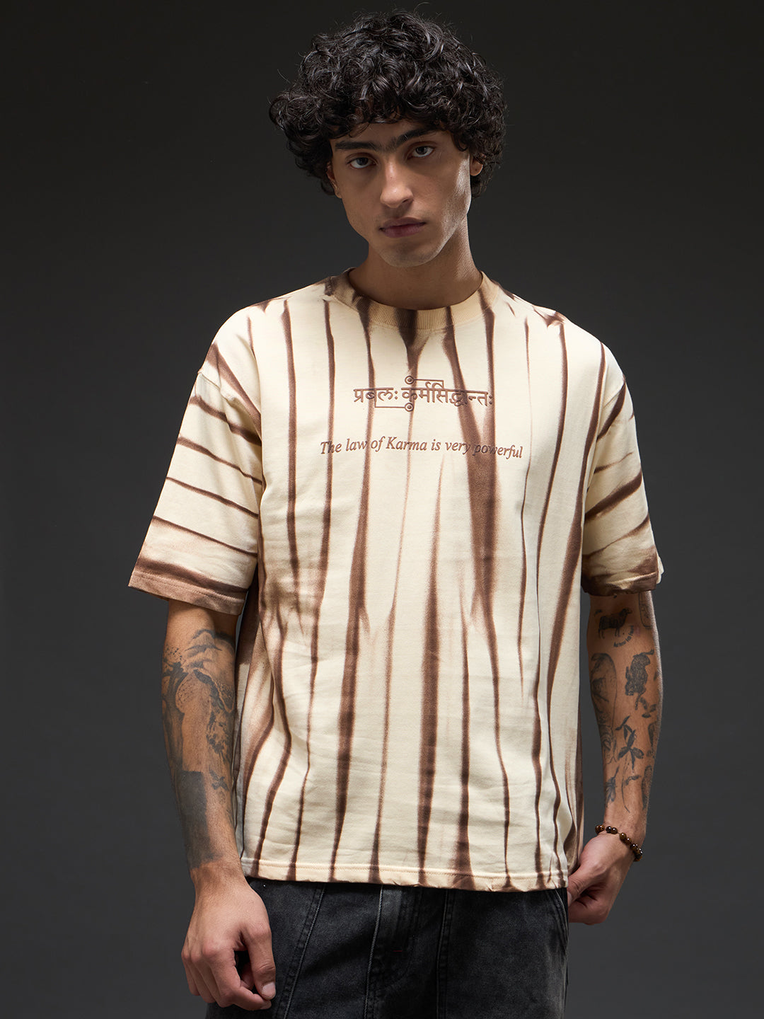 Beige oversized tee with spray and puff print from Rudrajap The Law of Karma, showing a relaxed fit and stylish design.