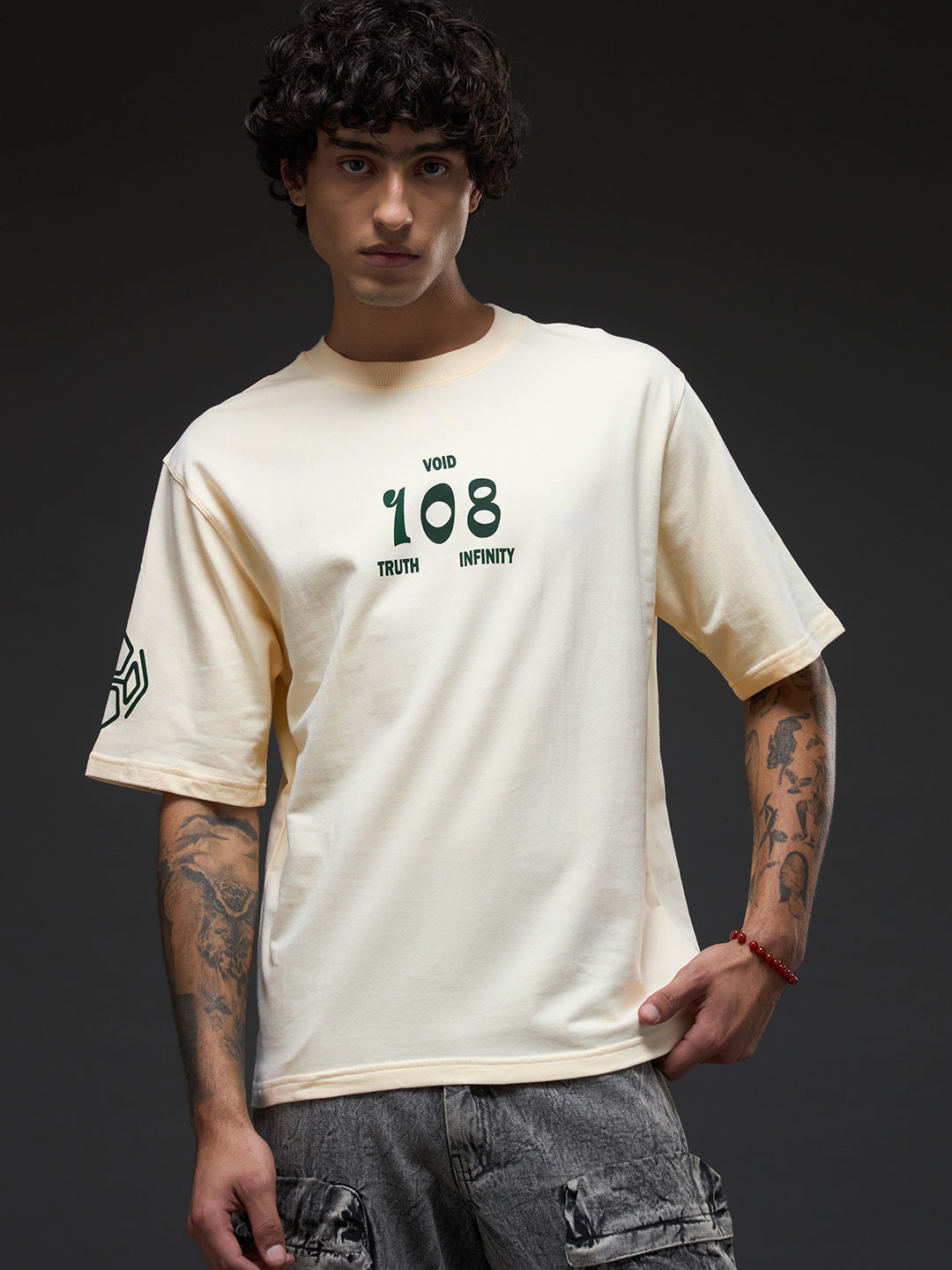 Rudrajap Tatva oversized T-shirt in soft fabric, featuring a relaxed fit and minimalist design, shown in a casual wear setting.