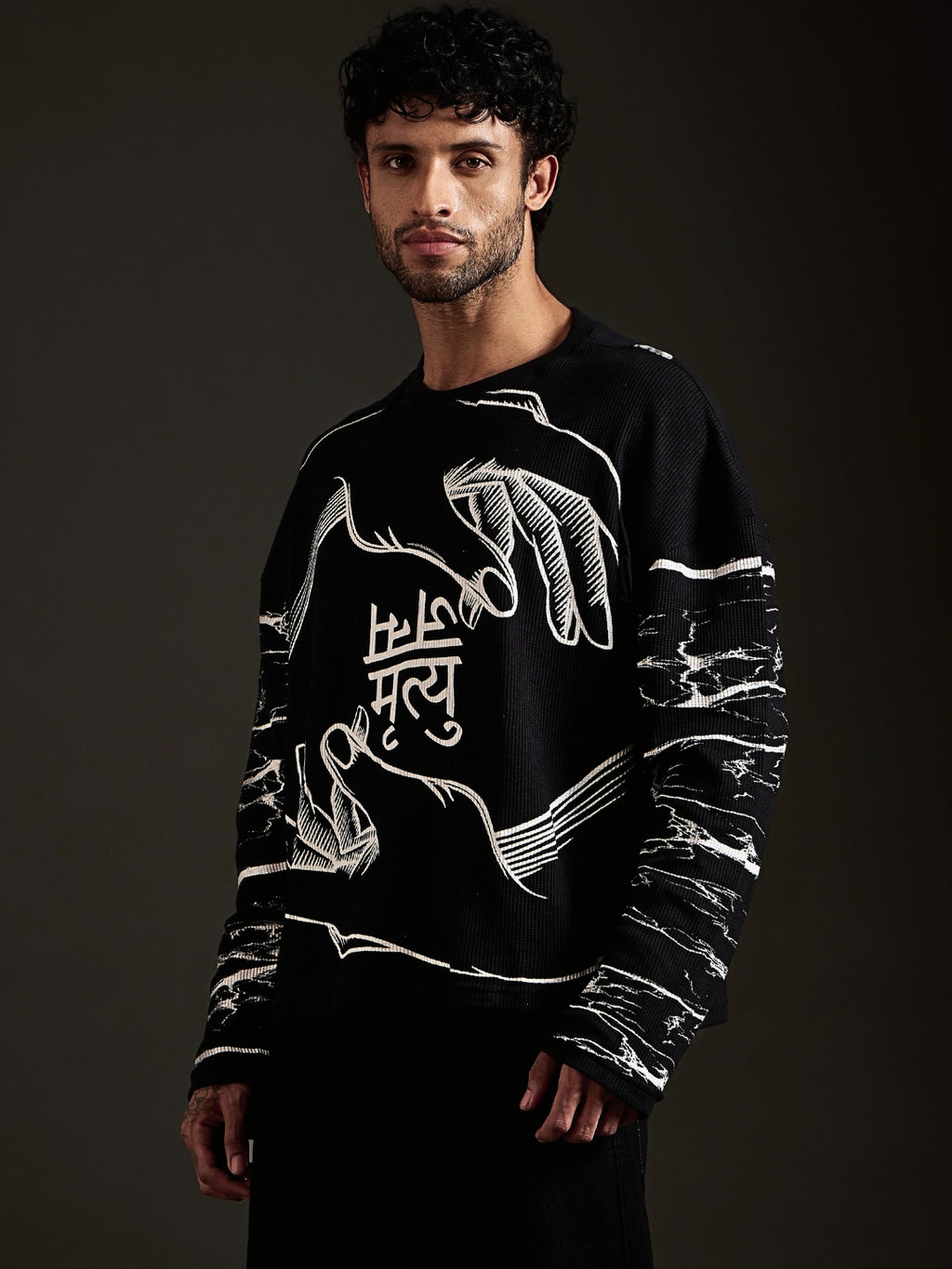 Model in Janam Mrityu boxy oversized tee with black baggy jeans