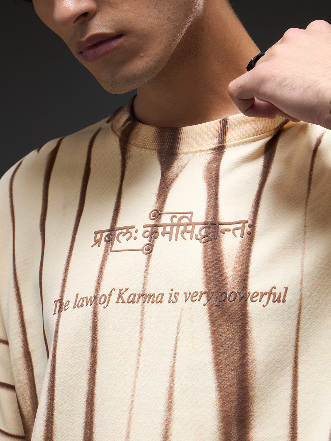 Beige oversized T-shirt with spray and puff print from Rudrajap's Law of Karma collection, featuring relaxed fit and casual style.