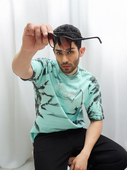 Mint Green Spray Print T-Shirt – "अंतः अस्ति प्रारंभः" (The End is the Beginning)