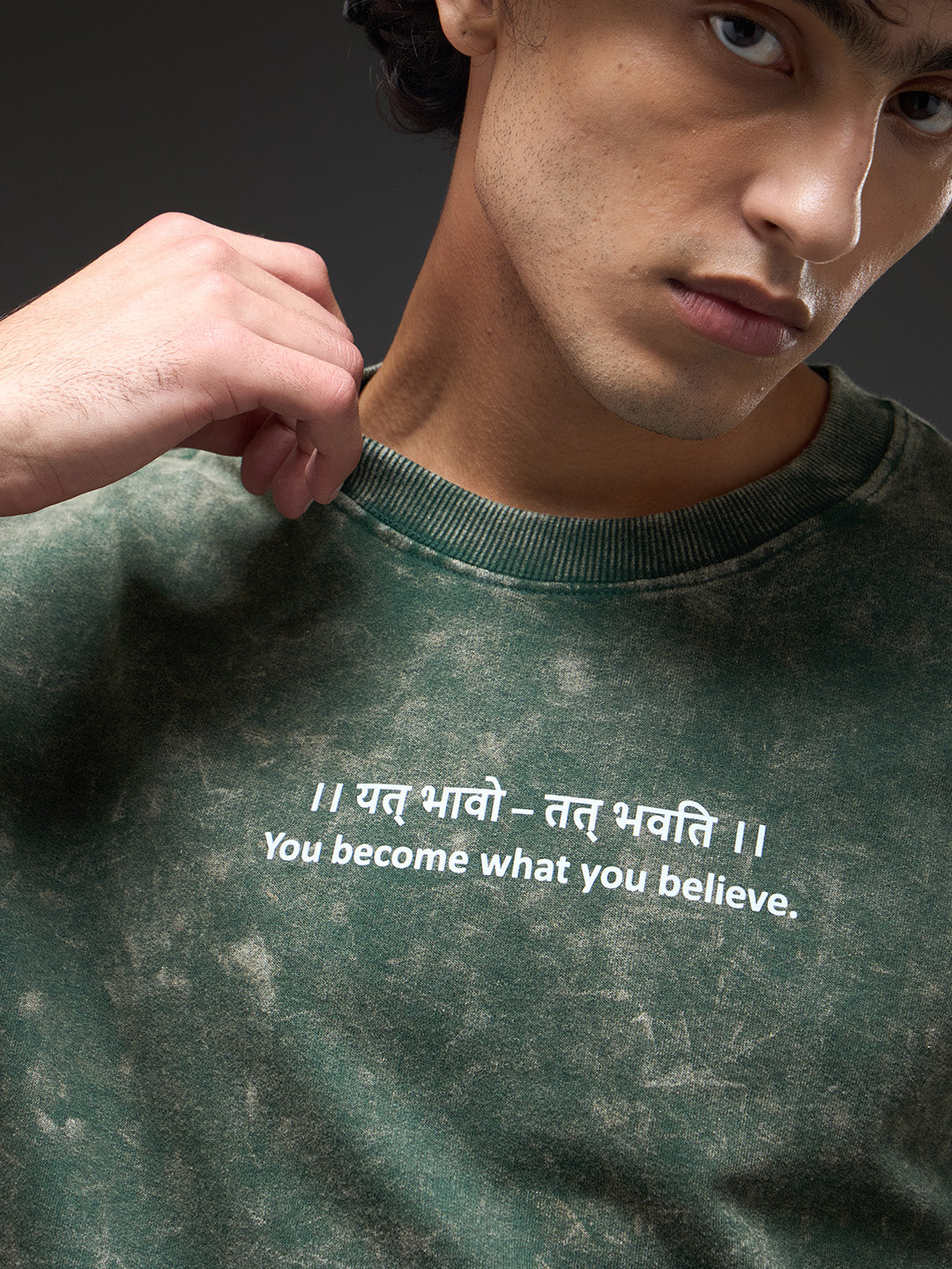 Moss green oversized acid wash T-shirt by Rudrajap with Sanskrit quote "Yat Bhavo Tat Bhavati" displayed on the front.