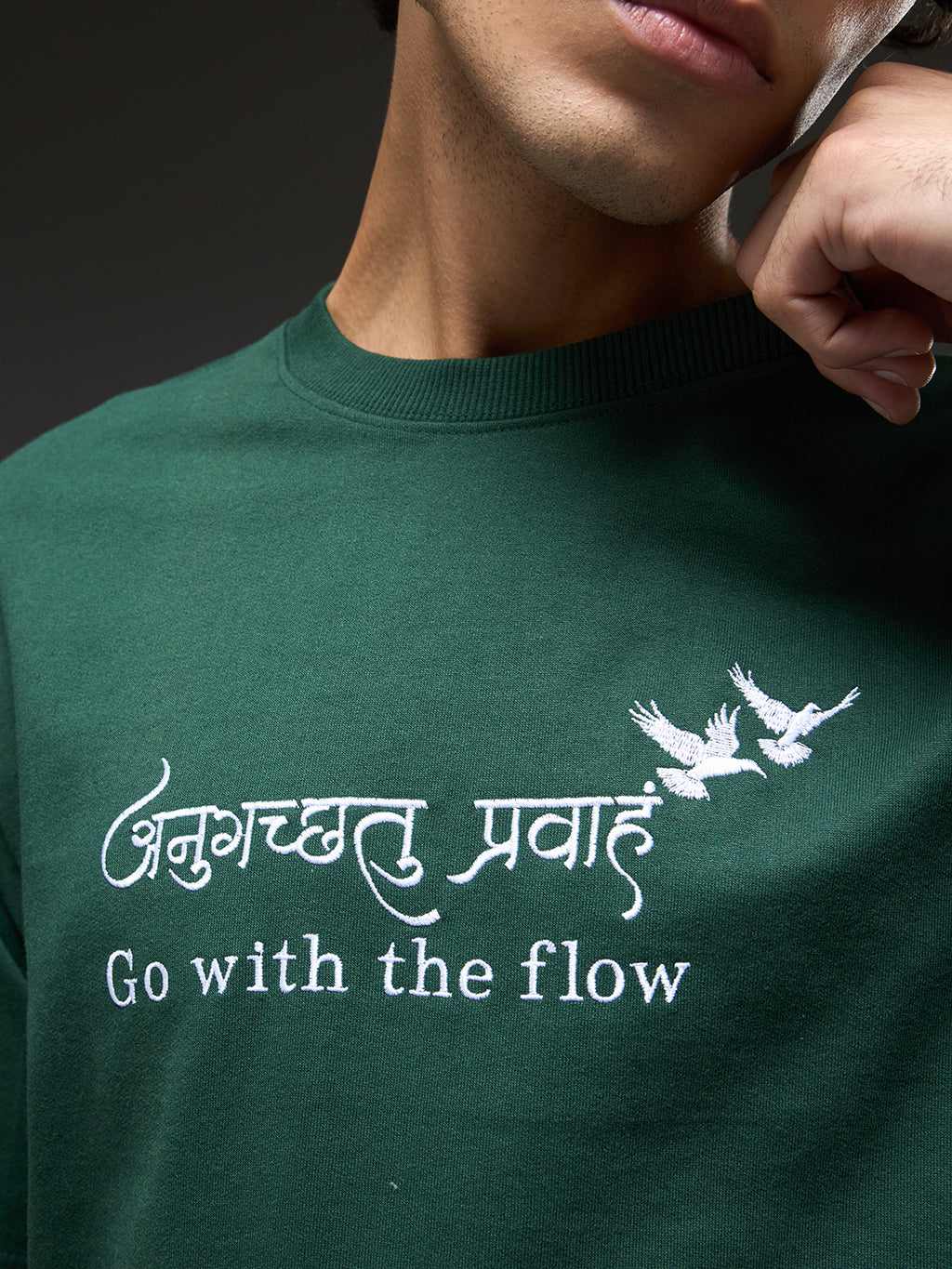 Bottle green recycled oversized T-shirt by Rudrajap with "Go With The Flow" embroidery, casual fit, and eco-friendly fabric.