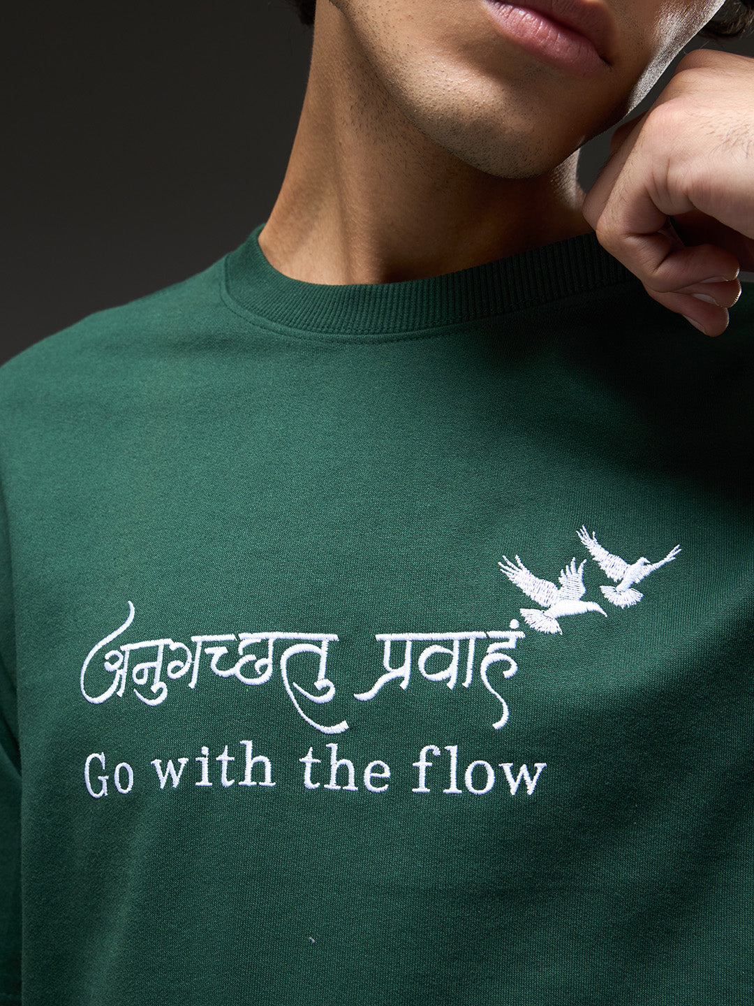 Bottle green recycled oversized T-shirt by Rudrajap with "Go With The Flow" embroidery, casual fit, and eco-friendly fabric.