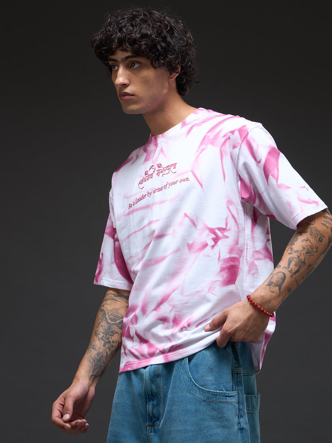 White oversized tee by Rudrajap with spray and puff print, featuring a relaxed fit and casual streetwear style.