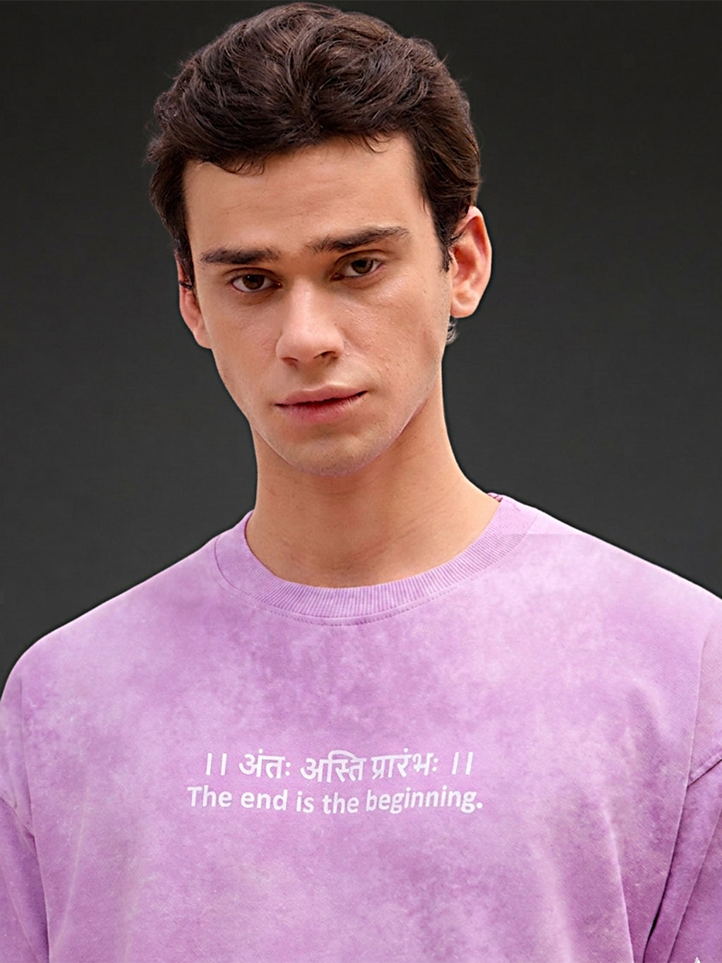 Lavender acid wash oversized T-shirt by Rudrajap with Sanskrit quote "Antah Asti Prarambhah" printed in black text.