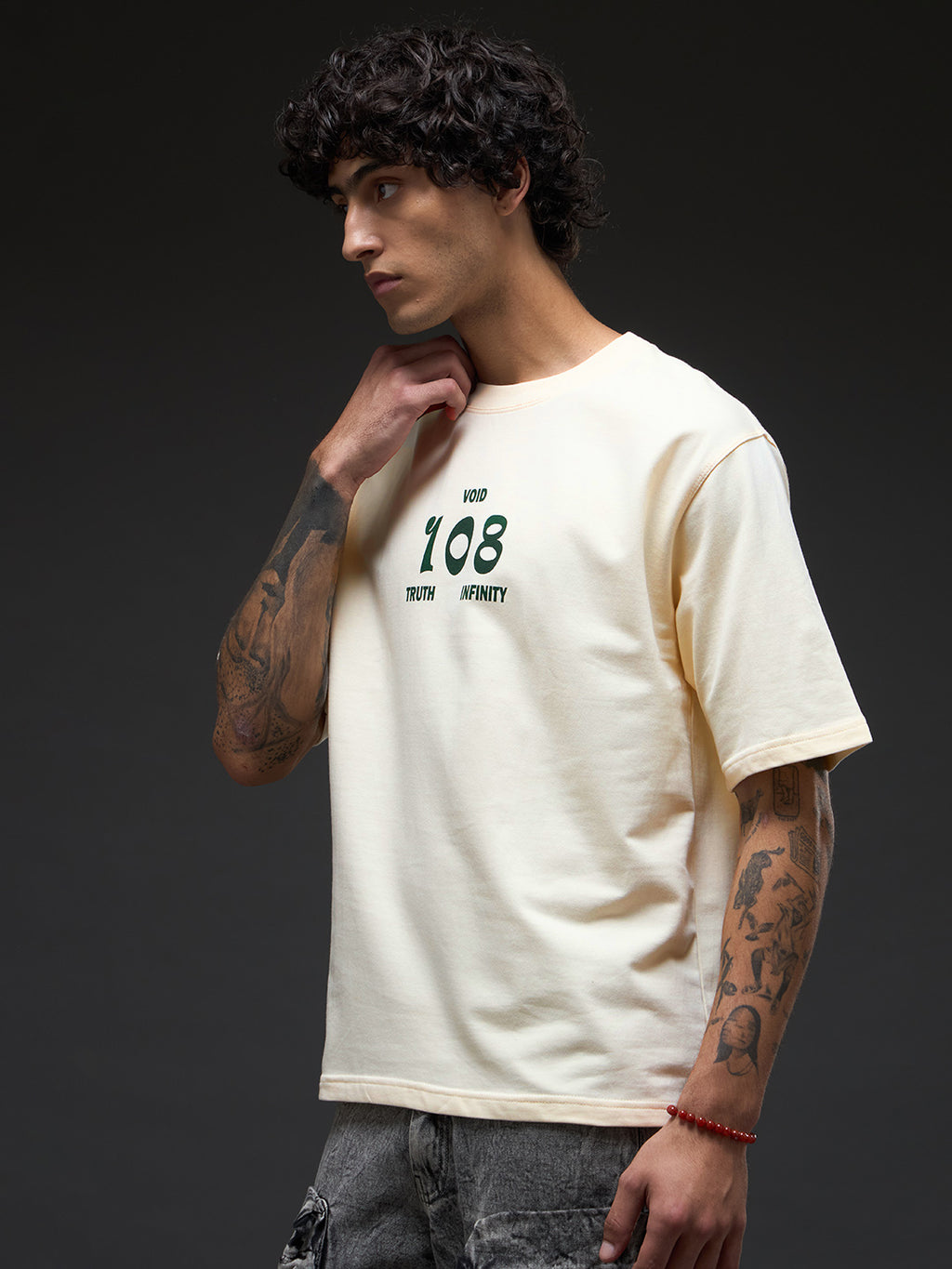 Rudrajap Tatva oversized T-shirt in soft fabric, featuring a relaxed fit and minimalist design, shown in a natural light.
