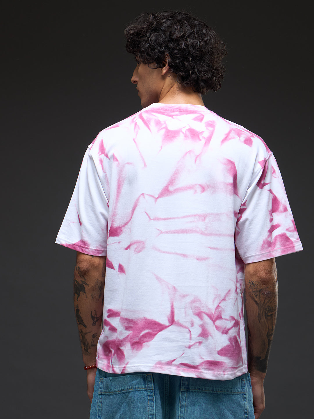 White oversized tee from Rudrajap with spray and puff print, featuring a relaxed fit and modern streetwear style.