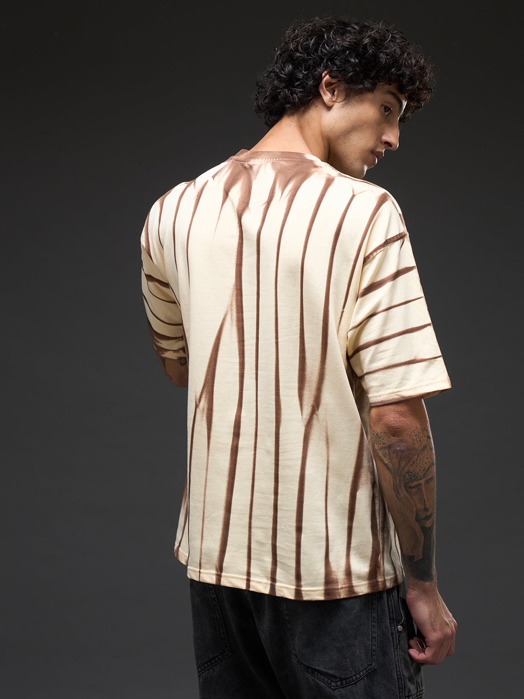 Beige oversized T-shirt with spray and puff print from Rudrajap's Law of Karma collection, casual fit and soft fabric.