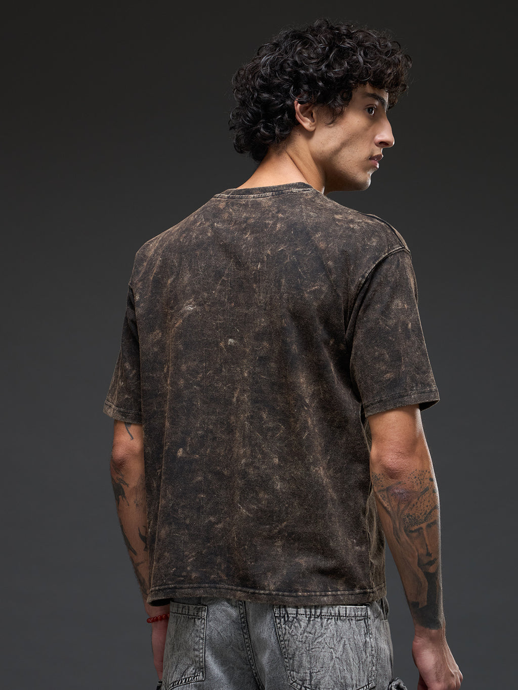 Black acid wash oversized T-shirt by Rudrajap with Sanskrit quote "।। यत् भावो – तत् भवति ।।" displayed on front.