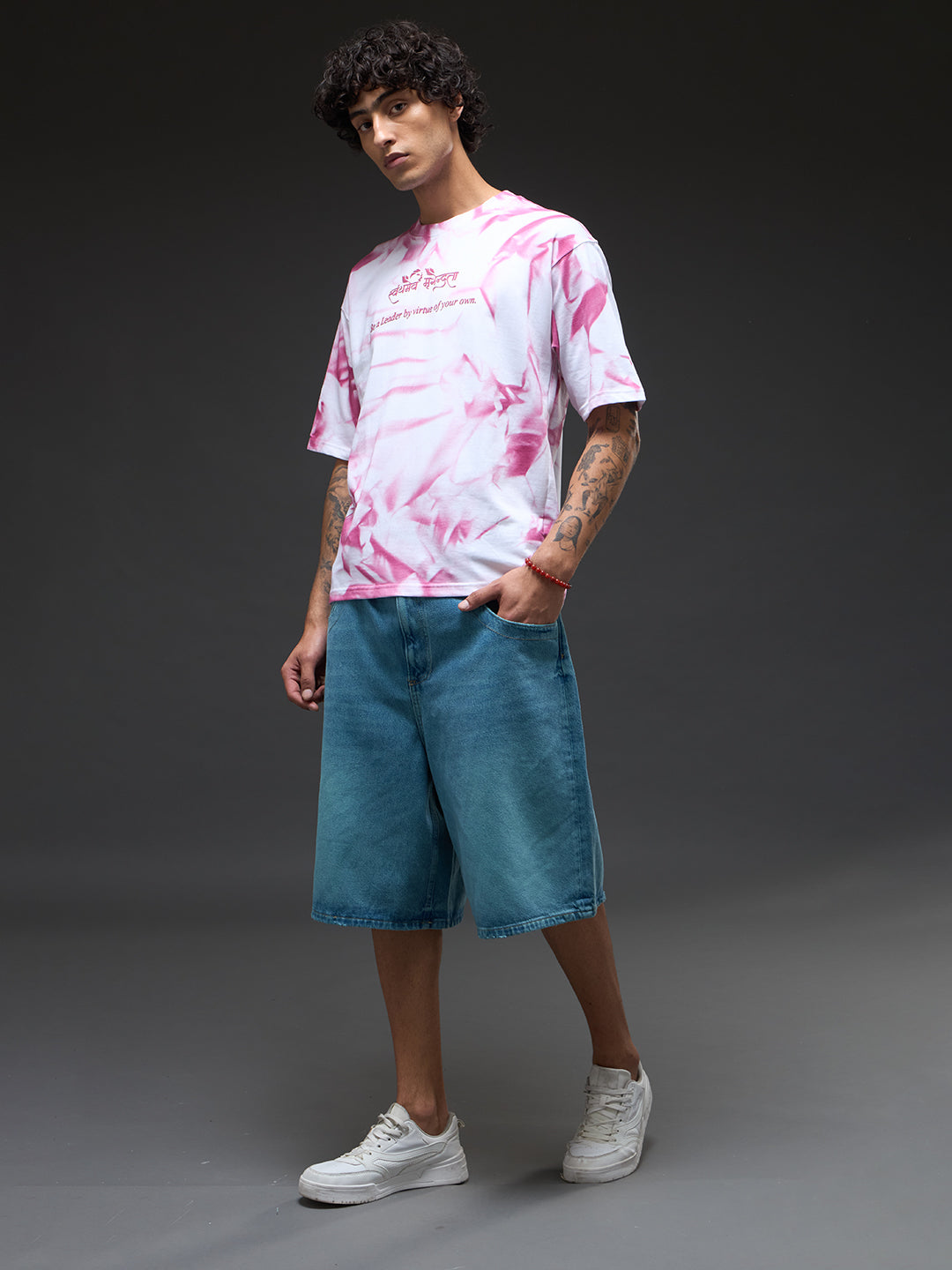 White oversized tee with spray and puff print from Rudrajap's Be A Leader collection, featuring a relaxed fit and graphic design.