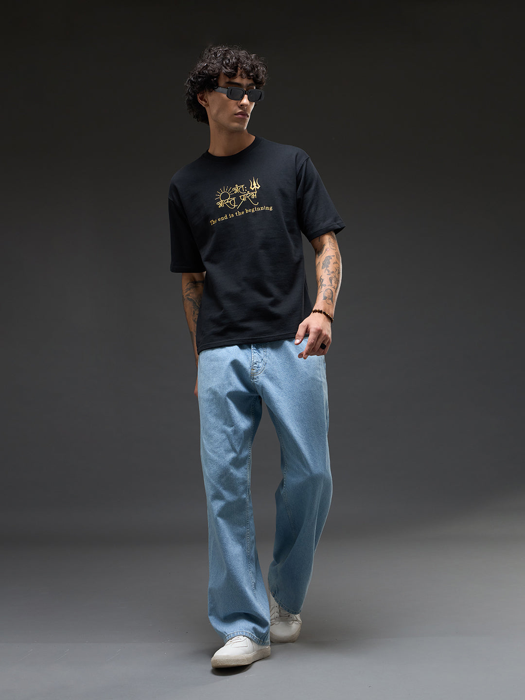 Black and mustard oversized recycled cotton tee by Rudrajap, featuring relaxed fit and eco-friendly fabric from The End is the Beginning collection.