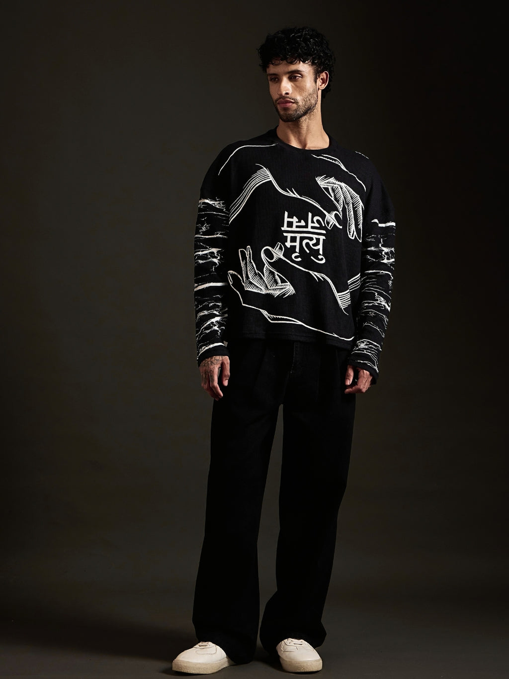 Janam Mrityu black oversized waffle tee front with two hands and Devanagari print