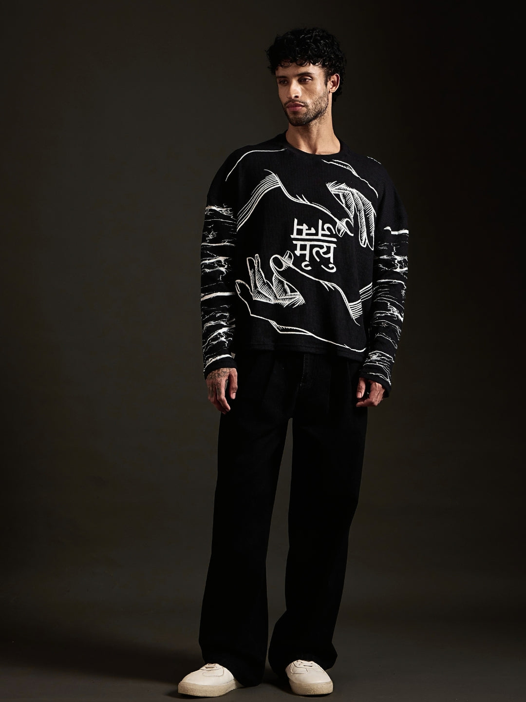 Janam Mrityu black oversized waffle tee front with two hands and Devanagari print