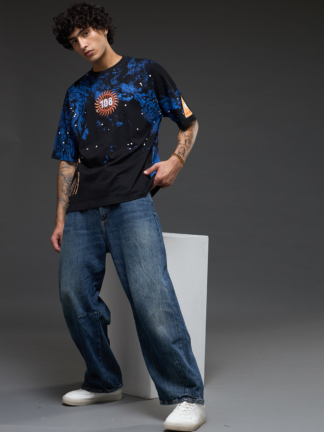 Rudrajap Vishwaroop oversized T-shirt in black with graphic print, casual fit, and crew neckline, displayed on a hanger.