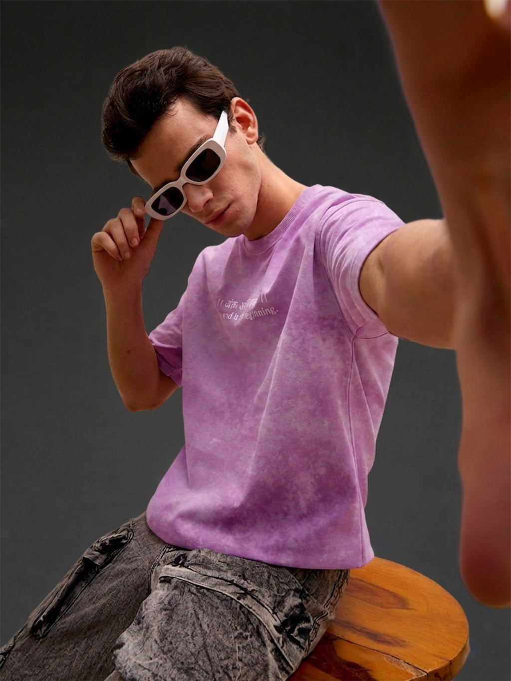 Lavender acid wash oversized T-shirt by Rudrajap featuring the Sanskrit quote "Antah Asti Prarambhah" in bold text.