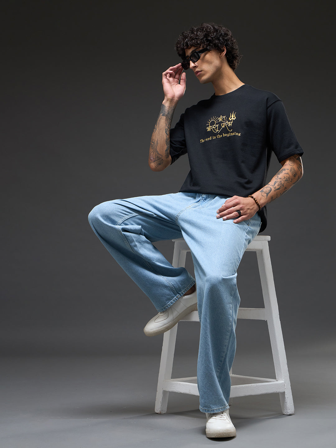 Black and mustard recycled oversized tee by Rudrajap featuring bold colors and relaxed fit, shown on a plain background.