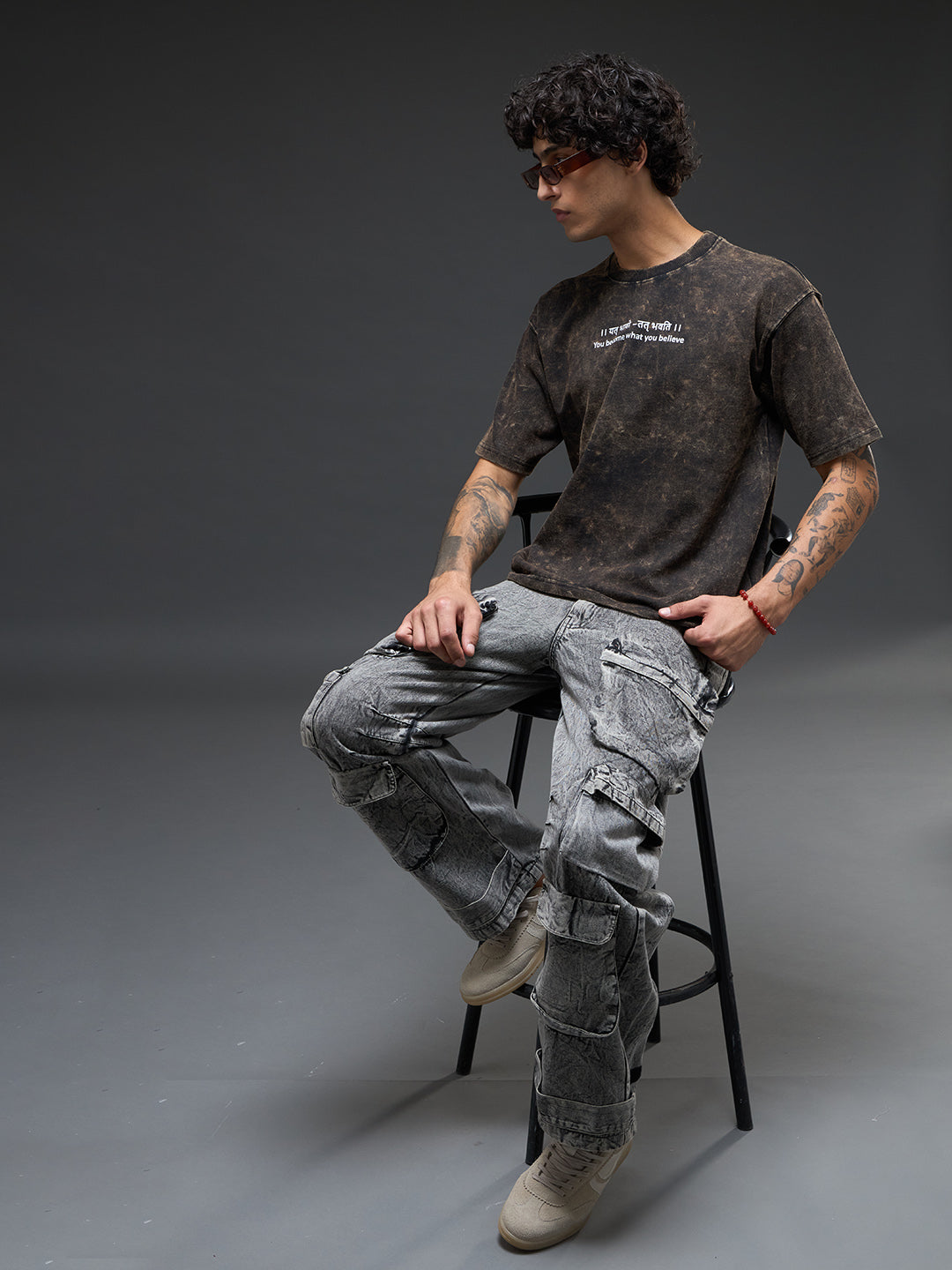 Black acid wash oversized T-shirt by Rudrajap featuring Sanskrit quote "।। यत् भावो – तत् भवति ।।" printed front.
