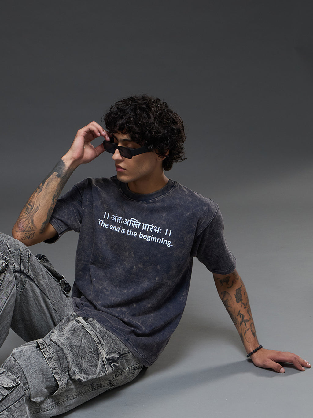 Set of three oversized Rudrajap burnout T-shirts in grey, royal blue, and black, displayed flat with rolled sleeves.