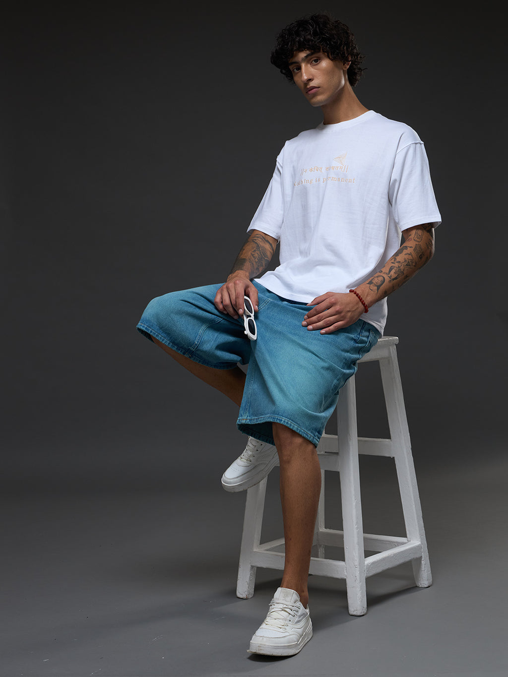 White and beige recycled oversized tee by Rudrajap featuring a relaxed fit and eco-friendly fabric.