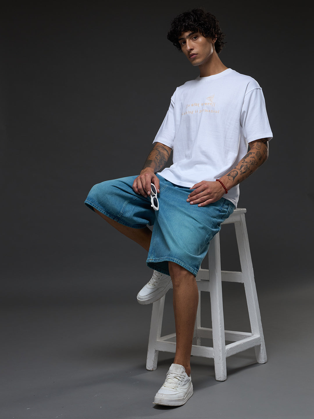 White and beige recycled oversized tee by Rudrajap featuring a relaxed fit and eco-friendly fabric.