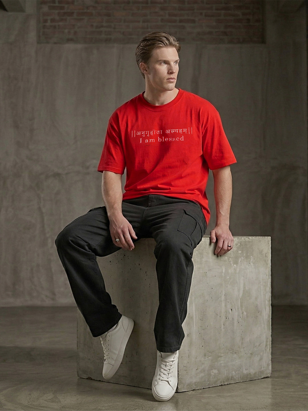 Red recycled oversized T-shirt by Rudrajap with premium embroidered "I Am Blessed" text, showcasing a casual fit and eco-friendly fabric.