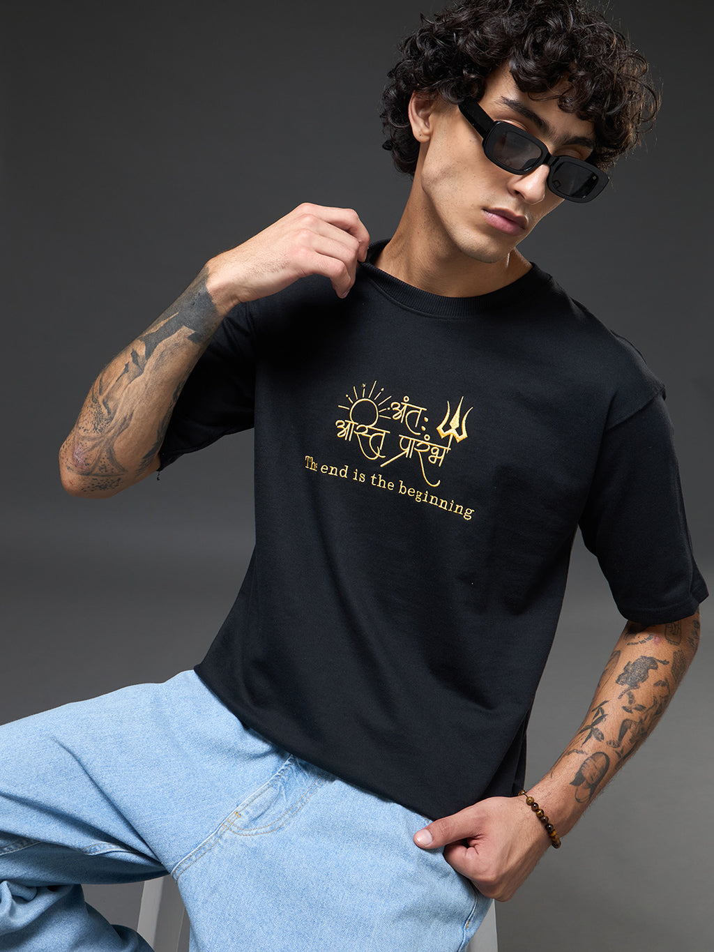Black and mustard recycled oversized tee by Rudrajap featuring bold color blocks and relaxed fit displayed on a flat lay.