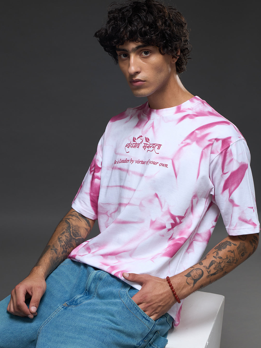 White oversized tee by Rudrajap with spray and puff print, featuring a relaxed fit and casual style.