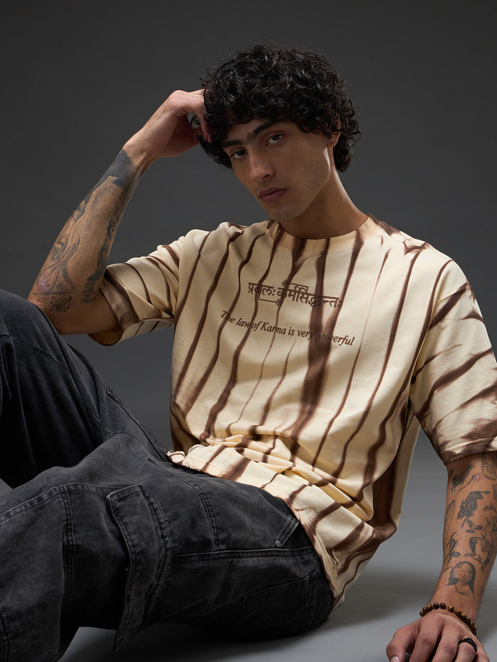 Beige oversized tee with spray and puff print, casual fit, by Rudrajap from The Law of Karma collection.